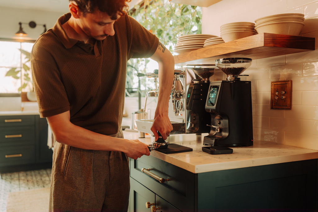 talent tamping down coffee for espresso lifestyle by clive coffee