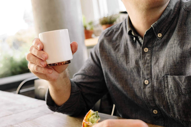 Man holding a Fellow Monty Cortado cup 4.5 oz Matte White, Clive Coffee - Lifestyle